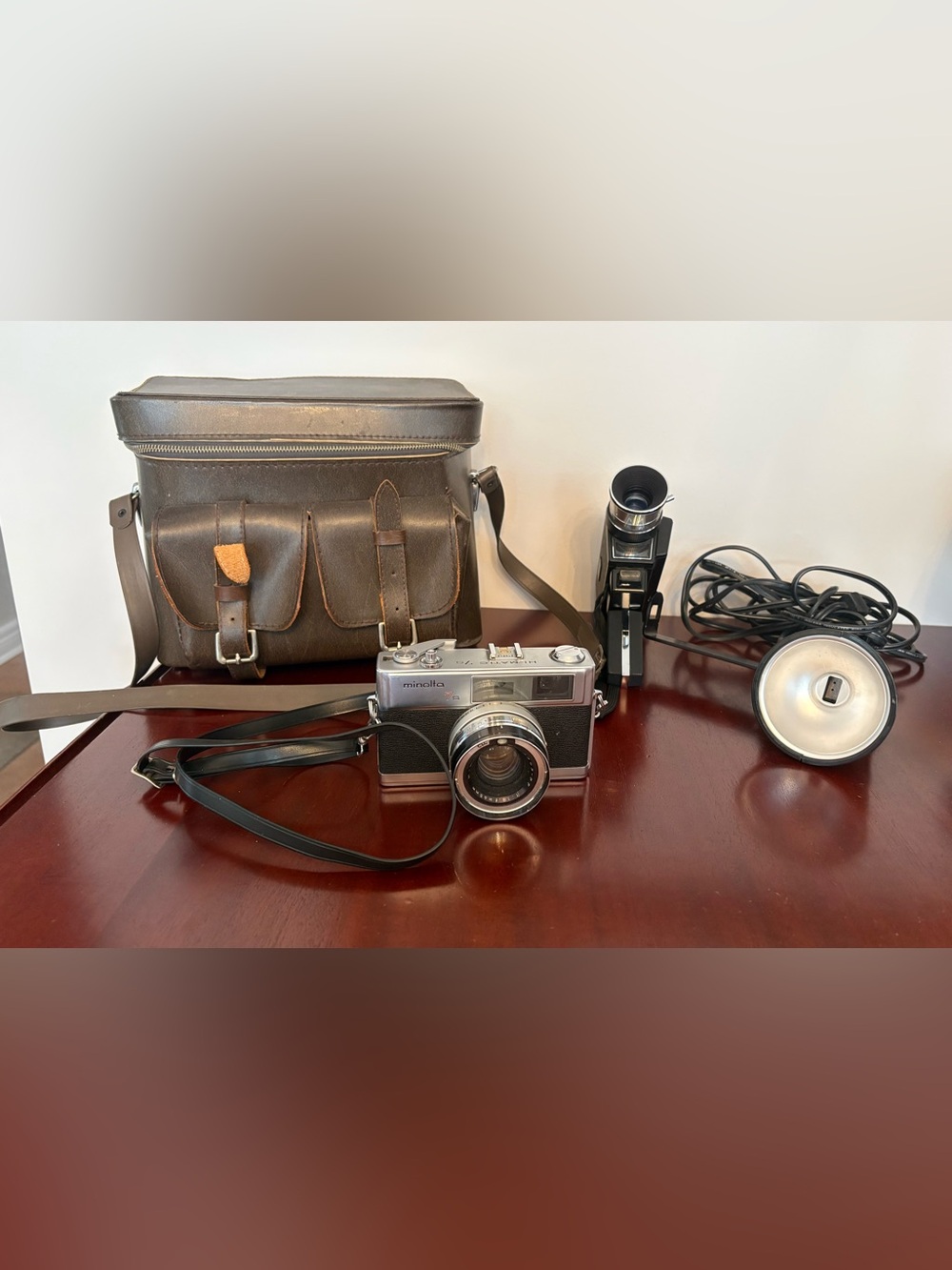 Vintage Minolta7s Hi-Matic, and
 Vintage Bell & Howell Movie Camera